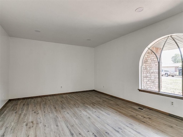 unfurnished room featuring light wood-type flooring