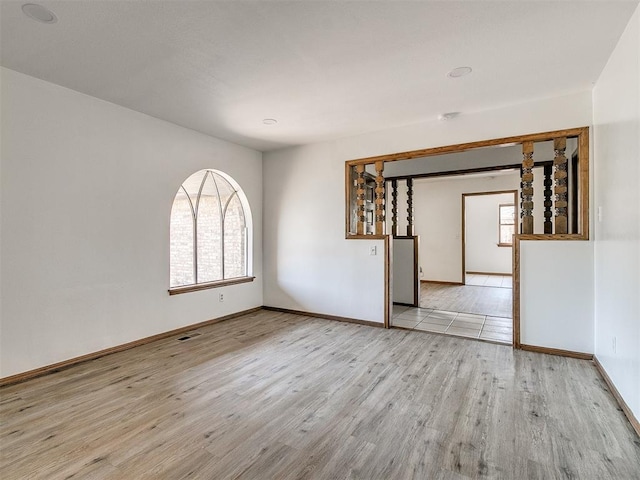 spare room with light wood-type flooring