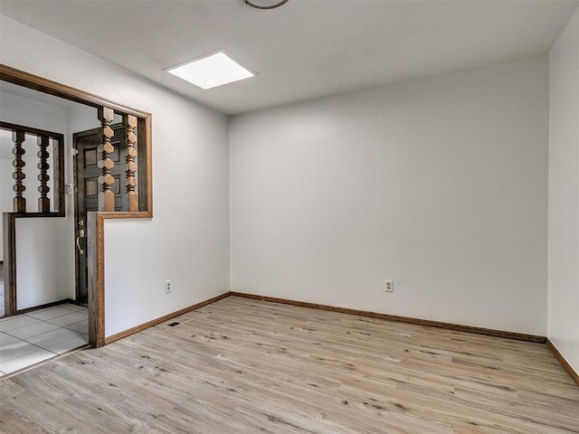 spare room featuring light hardwood / wood-style floors