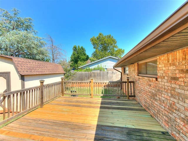 wooden deck with a storage shed