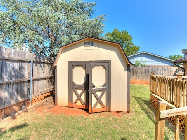 view of outdoor structure with a lawn