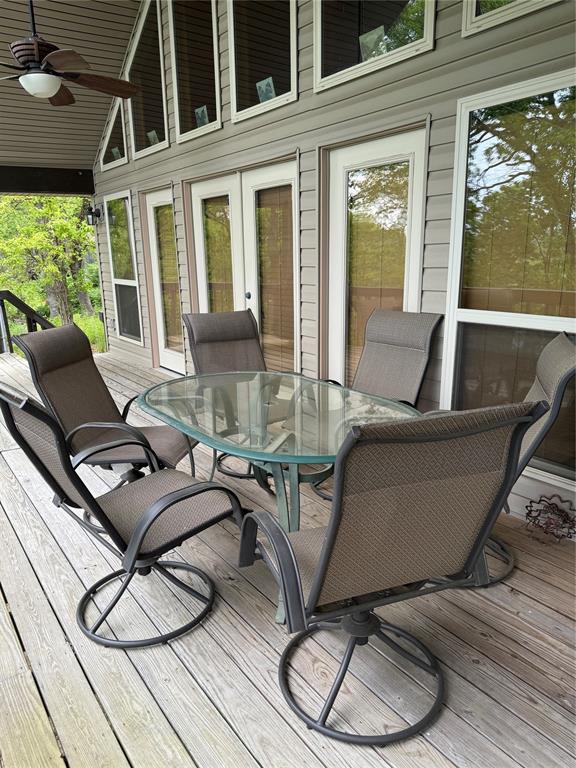 wooden terrace featuring ceiling fan