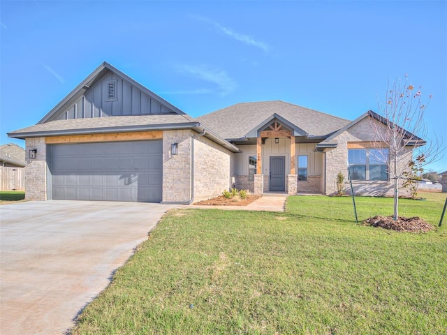 view of front of house with a garage and a front lawn