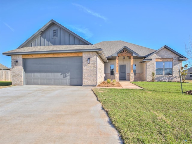 view of front of property with a front lawn and a garage