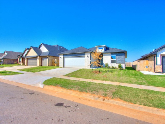 view of front of home featuring a front yard and a garage