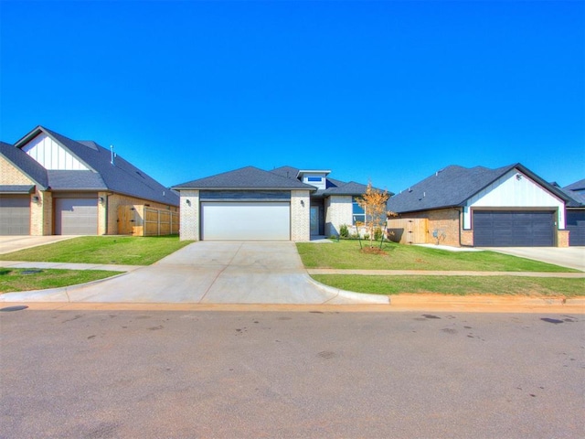 view of front of home with a garage and a front yard