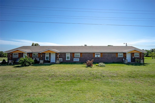 ranch-style home featuring a front yard