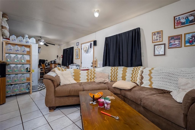 living room featuring light tile patterned floors and ceiling fan