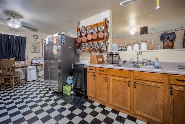 kitchen with ceiling fan, stainless steel fridge, and sink