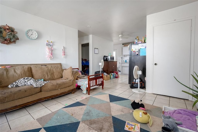 tiled living room featuring ceiling fan