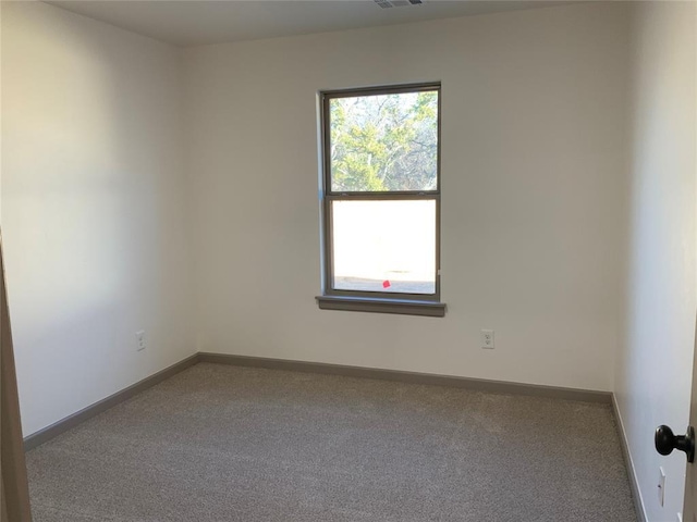 empty room with carpet flooring