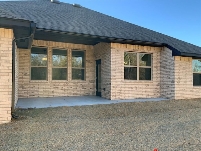 doorway to property with a patio area