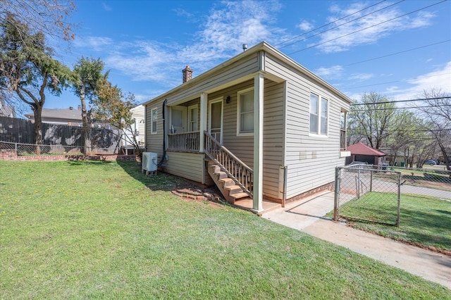 view of property exterior featuring a porch and a yard