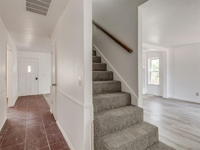 staircase featuring hardwood / wood-style floors