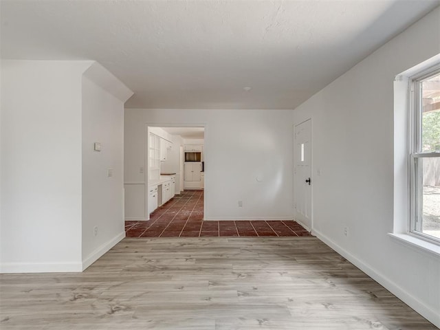 unfurnished room with light hardwood / wood-style flooring