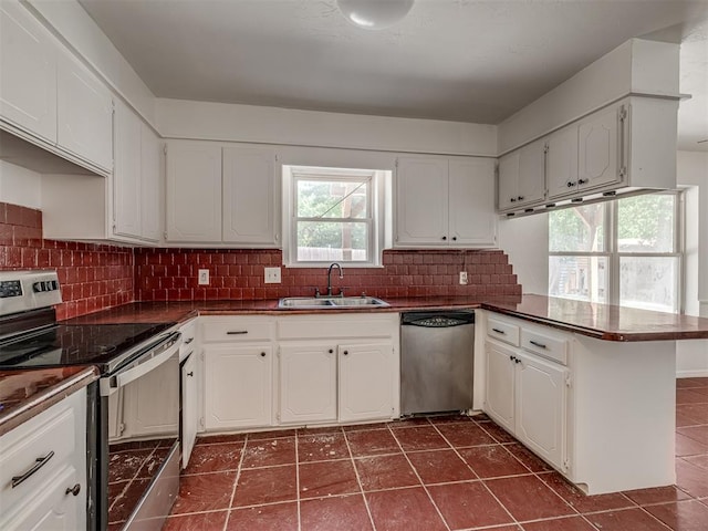 kitchen with sink, white cabinetry, and stainless steel appliances