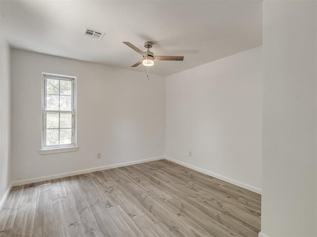 unfurnished room featuring light hardwood / wood-style flooring and ceiling fan