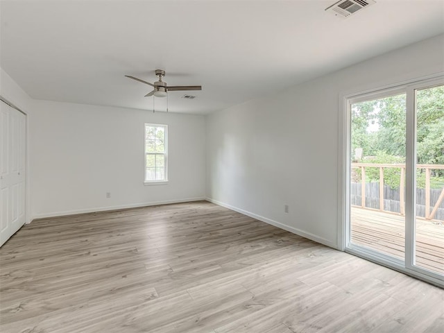 unfurnished room featuring light hardwood / wood-style flooring and ceiling fan