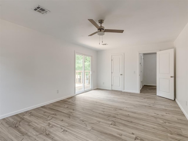 unfurnished bedroom featuring access to exterior, light hardwood / wood-style flooring, and ceiling fan