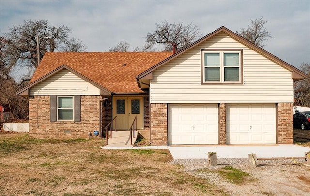 view of front of property with a garage