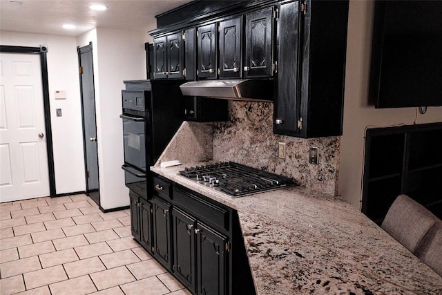 kitchen with backsplash, black oven, light stone countertops, and stainless steel gas cooktop