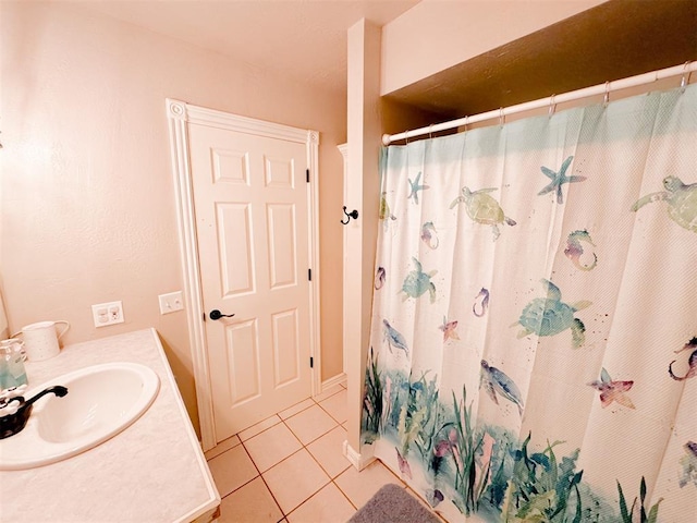 bathroom featuring tile patterned flooring, vanity, and a shower with shower curtain