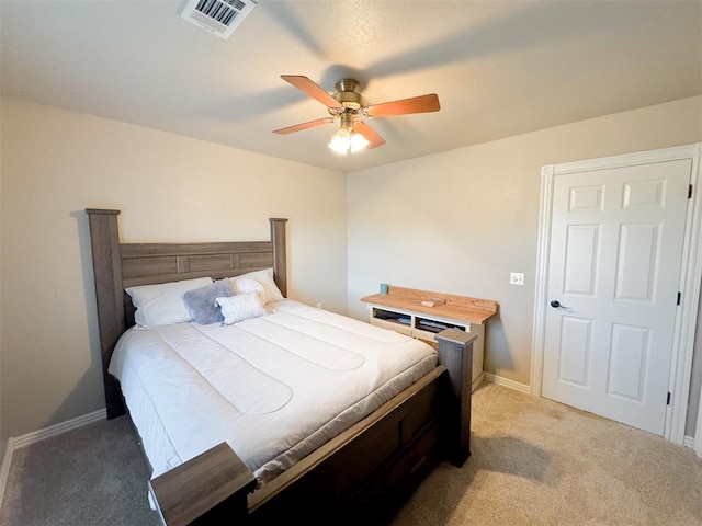 bedroom with ceiling fan and carpet