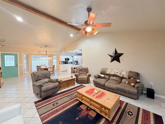 living room with light tile patterned floors, lofted ceiling with beams, and ceiling fan