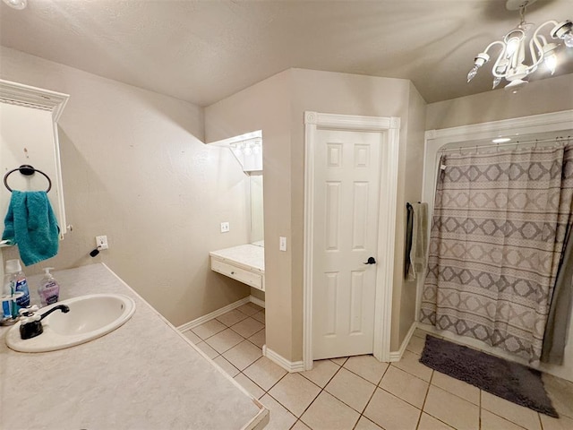 bathroom with tile patterned flooring, a shower with curtain, and vanity