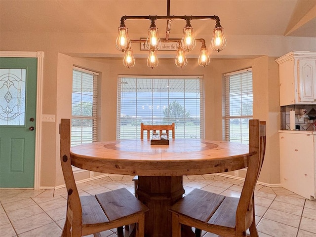 tiled dining room with a wealth of natural light