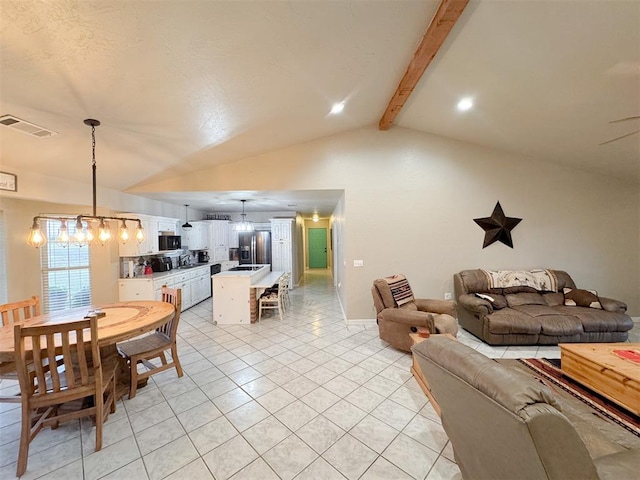 living room featuring light tile patterned flooring and lofted ceiling with beams