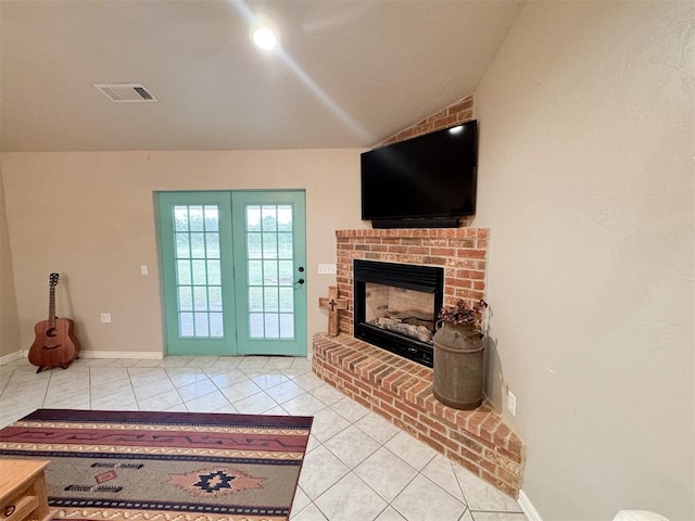 interior space with a fireplace and vaulted ceiling