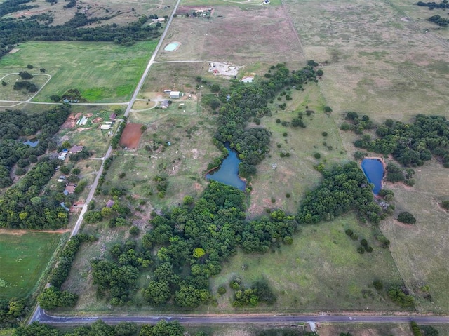 bird's eye view featuring a water view and a rural view