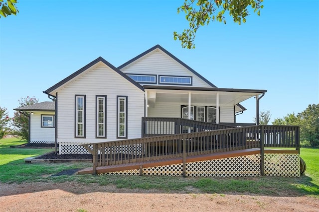 back of house with a wooden deck