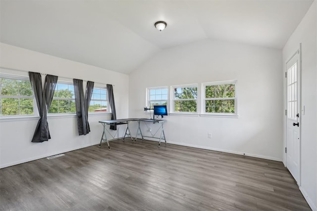 unfurnished office featuring dark hardwood / wood-style flooring and lofted ceiling