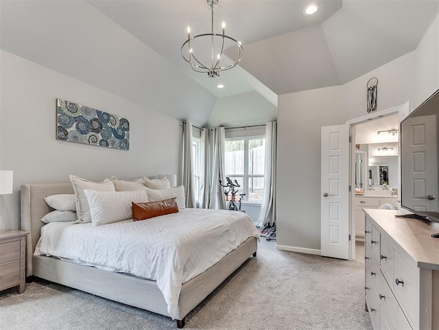 bedroom with connected bathroom, light carpet, vaulted ceiling, and a notable chandelier