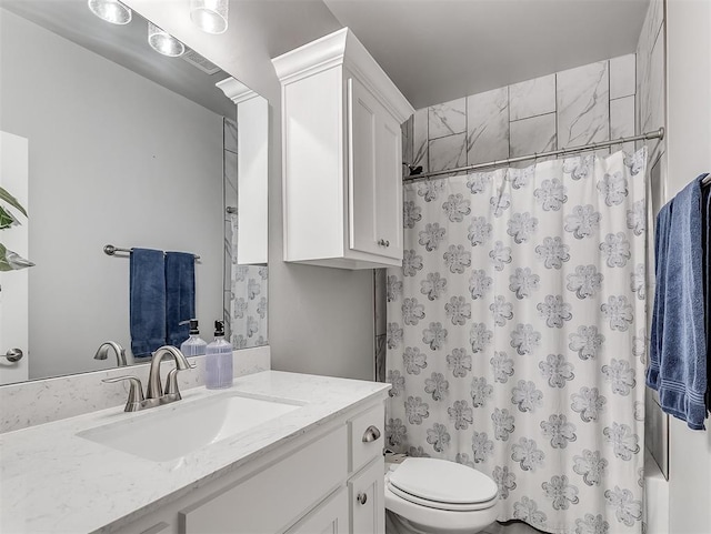 full bathroom featuring vanity, toilet, and shower / bath combo