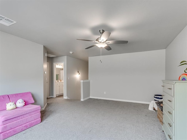 interior space with ceiling fan and light colored carpet