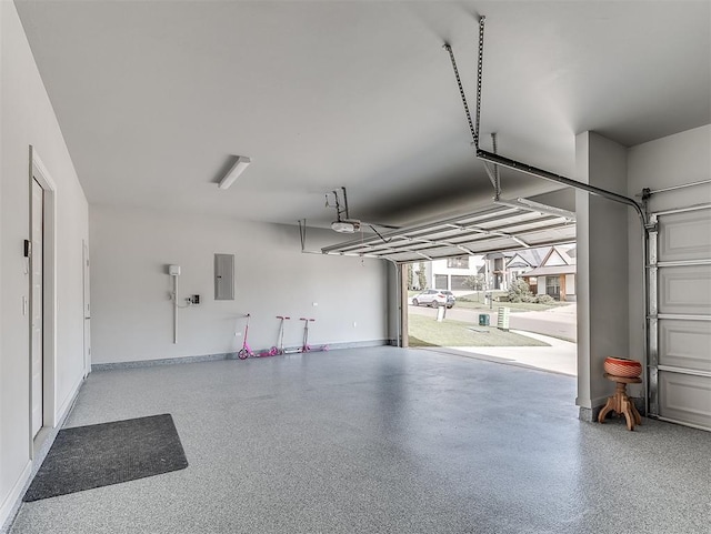 garage with electric panel and a garage door opener