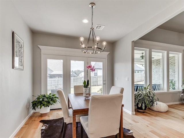 8216 Crew Ln, Edmond, OK 73034 - dining area featuring plenty of natural light, a chandelier, light wood finished floors, and recessed lighting