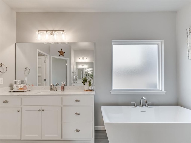 8216 Crew Ln, Edmond, OK 73034 - full bathroom with a freestanding tub and vanity