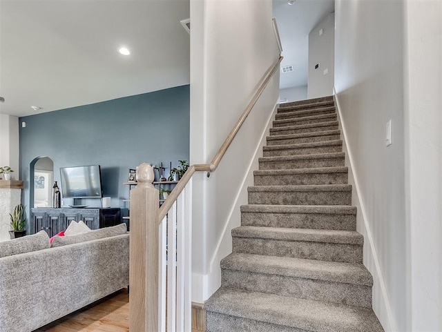 8216 Crew Ln, Edmond, OK 73034 - stairs featuring wood finished floors and recessed lighting