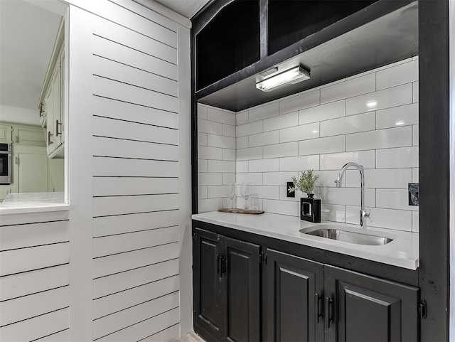 kitchen featuring decorative backsplash and sink