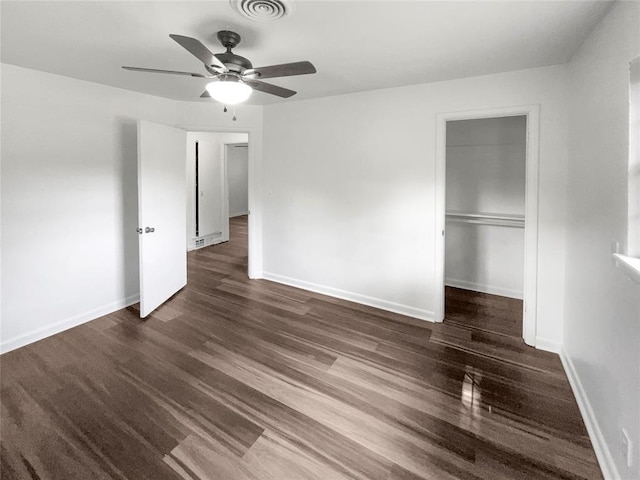 unfurnished bedroom featuring ceiling fan, a closet, and dark hardwood / wood-style floors