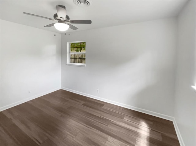 unfurnished room with ceiling fan and dark hardwood / wood-style flooring