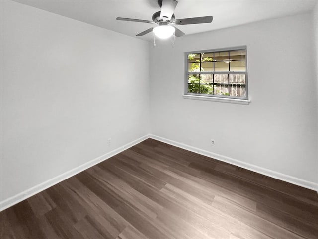 unfurnished room featuring ceiling fan and dark hardwood / wood-style flooring