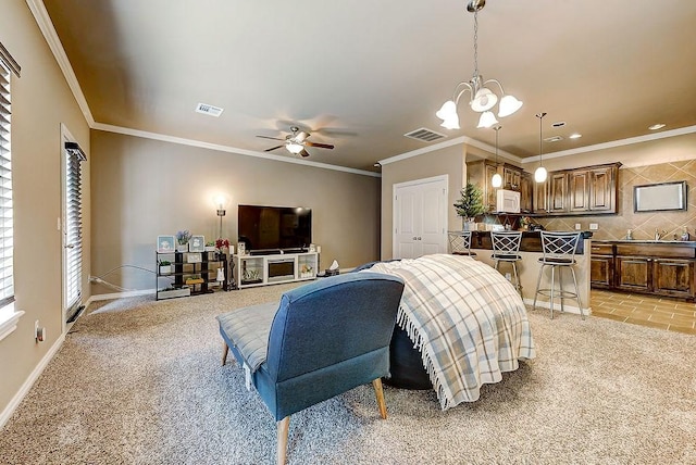 bedroom featuring a chandelier, light colored carpet, and ornamental molding