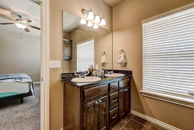 bathroom featuring vanity, tile patterned floors, and ceiling fan