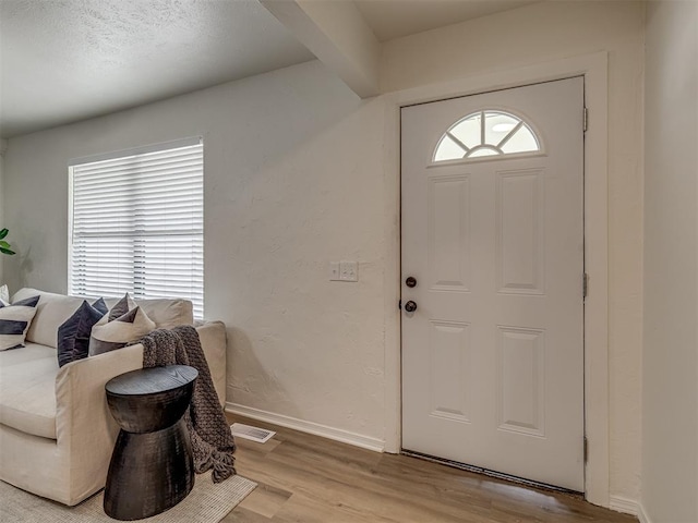 foyer with light wood-type flooring