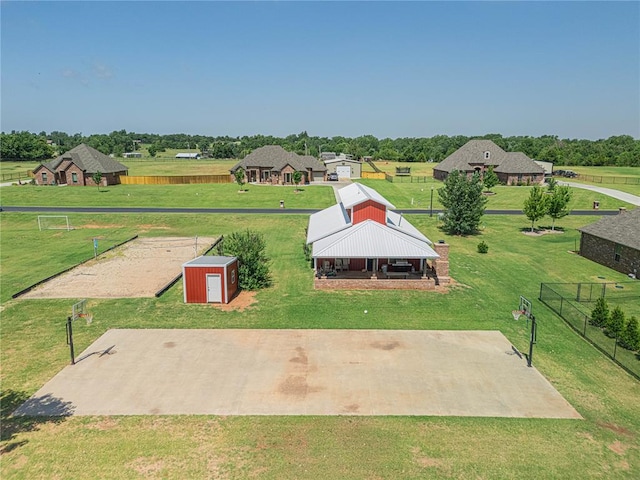 view of home's community with an outdoor structure